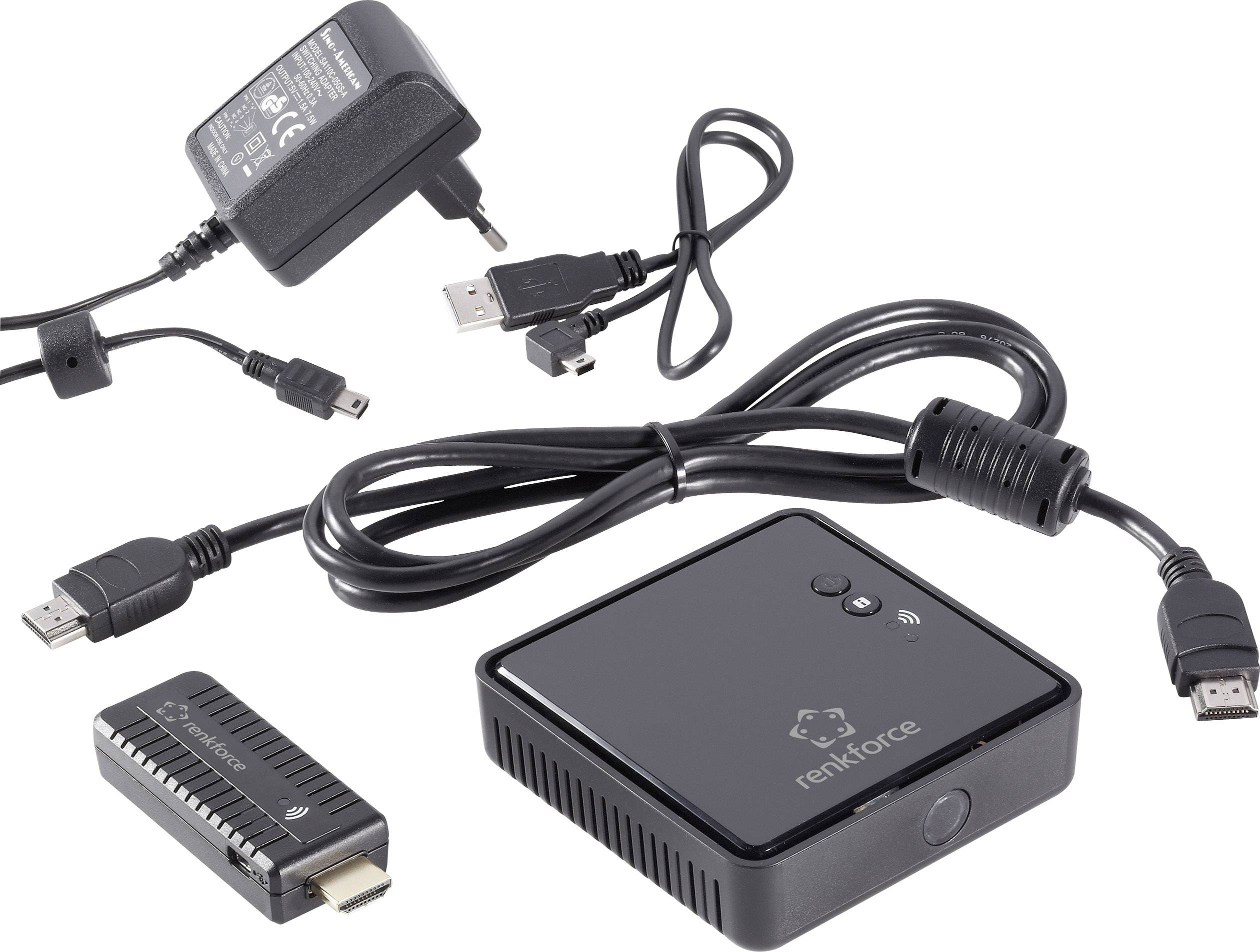 Ein kleines schwarzes Elektronikgerät mit Anschlusskabeln, einem Netzteil und einem HDMI-Stick. Hauptgerät trägt die Aufschrift 'renkforce'.