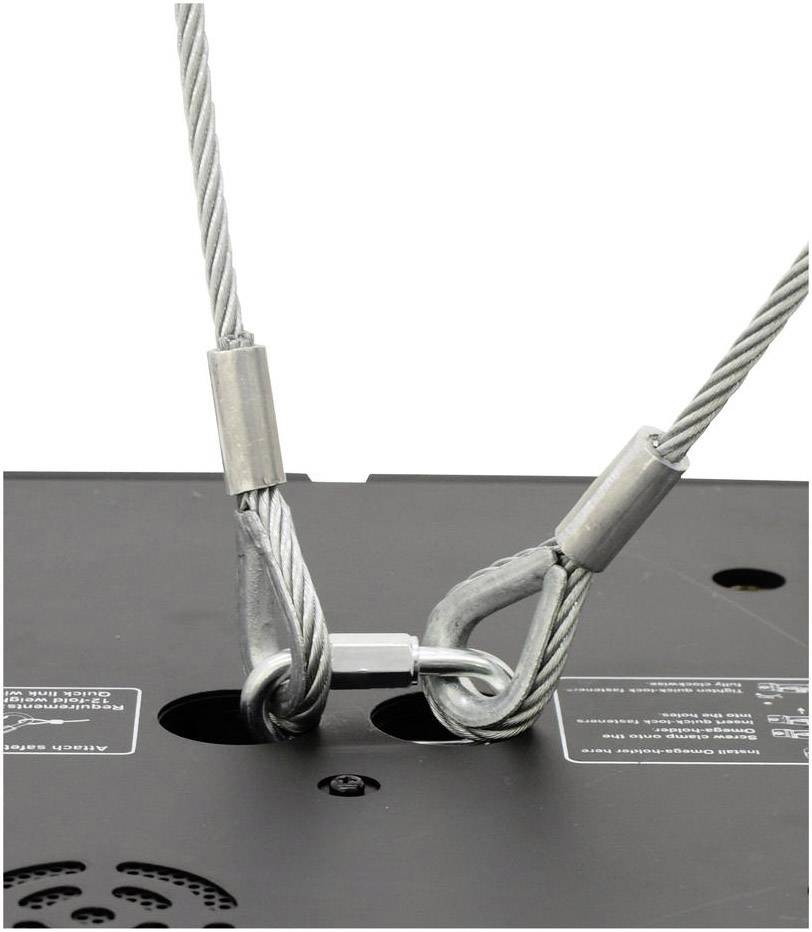 Stahlseile, die an einer schwarzen Metallplatte befestigt sind. Das Bild zeigt eine Sicherungskonstruktion.