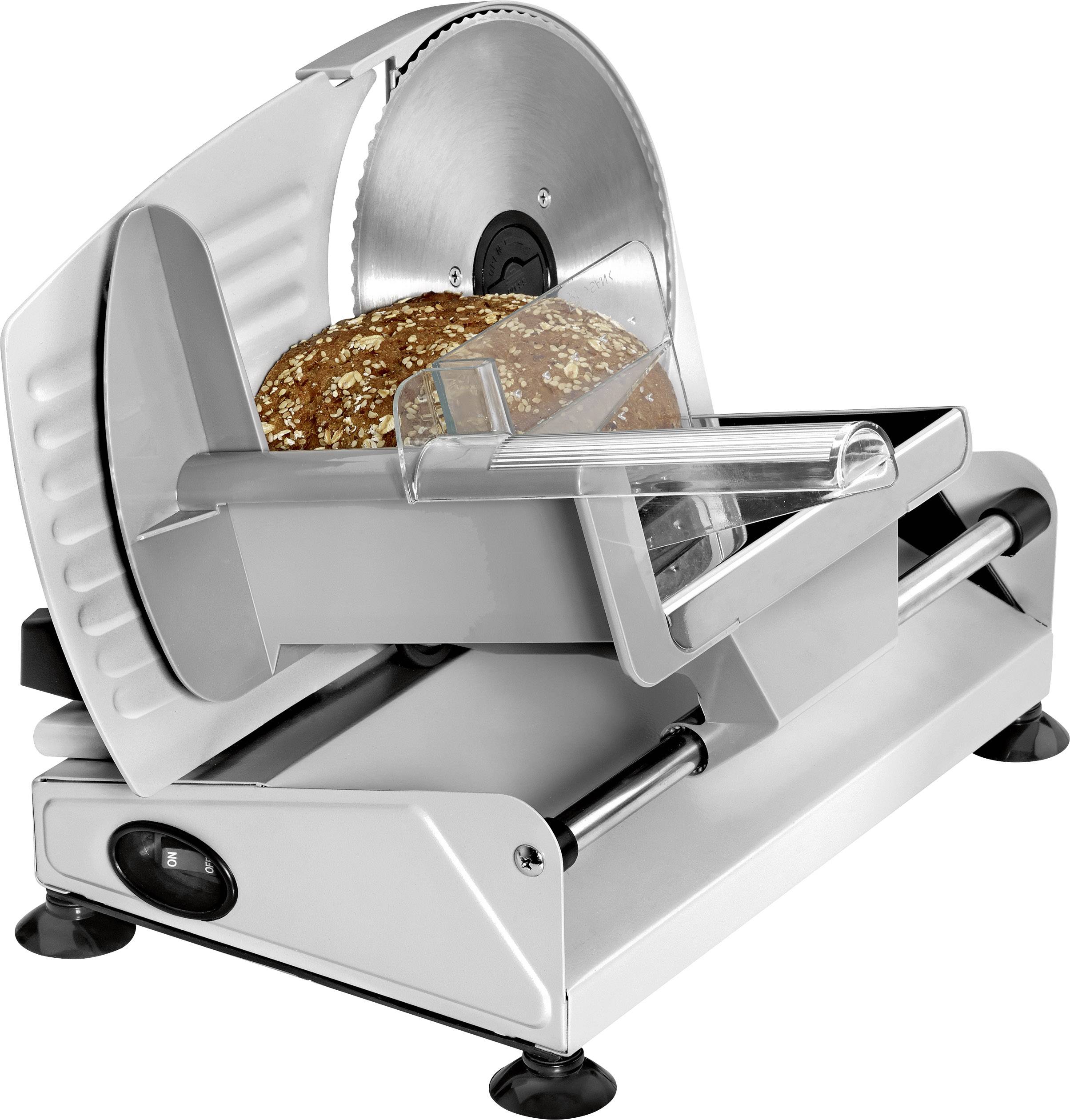 Brotschneidemaschine schneidet eine Scheibe aus einem Laib Mehrkornbrot.