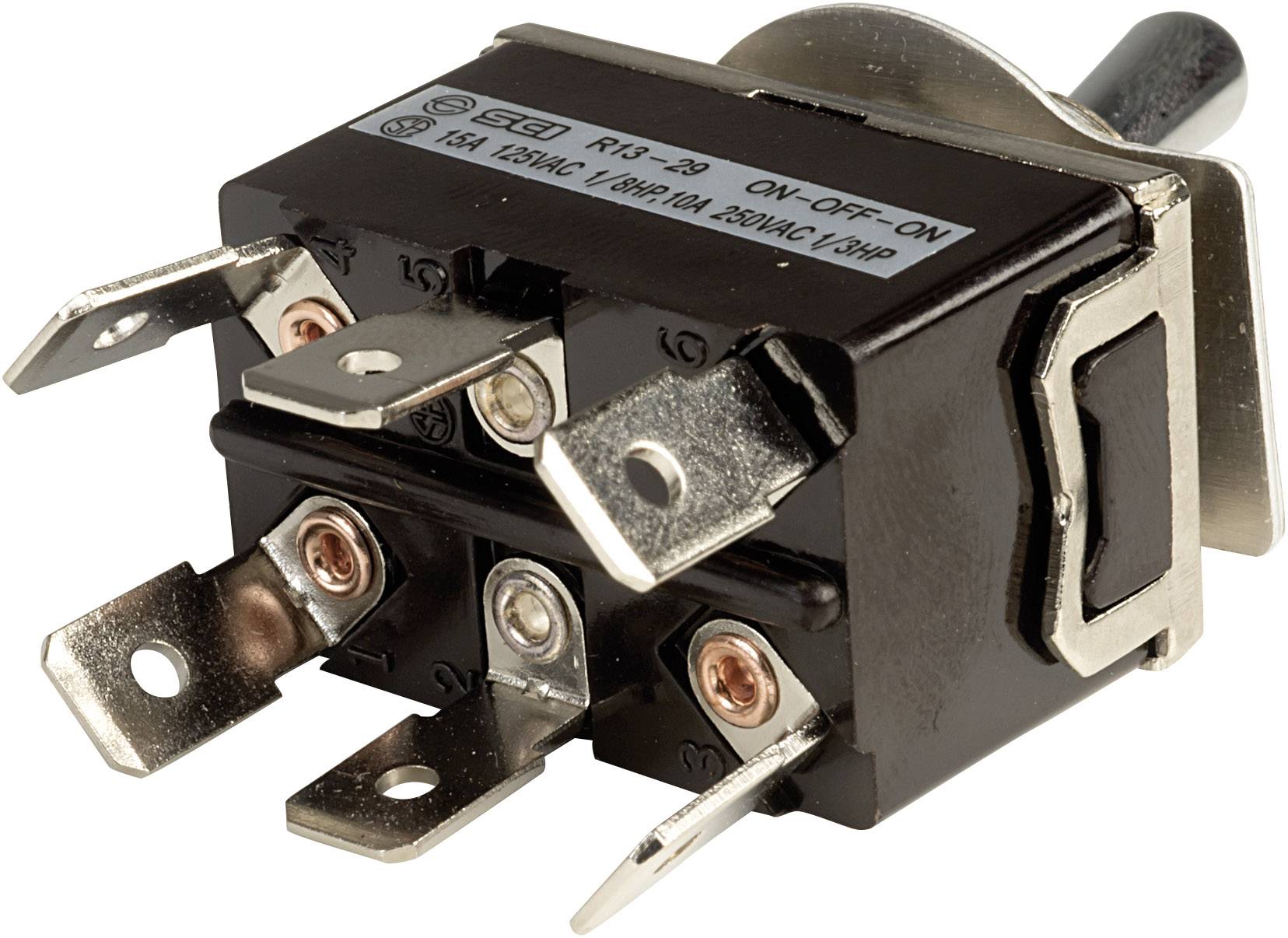 Ein elektrischer Kippschalter mit Metallhebel, mehreren Anschlussklemmen und einem Etikett mit technischen Spezifikationen.