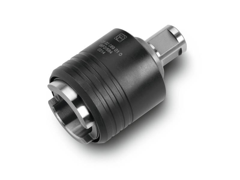 Ein zylindrisches Metallteil mit schwarzem und silbernem Finish. Es hat eine verzahnte Kante und eingravierte Seriennummern.
