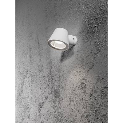Eine weiße Wandlampe, die an einer rauen, grauen Wand montiert ist und nach unten leuchtet.