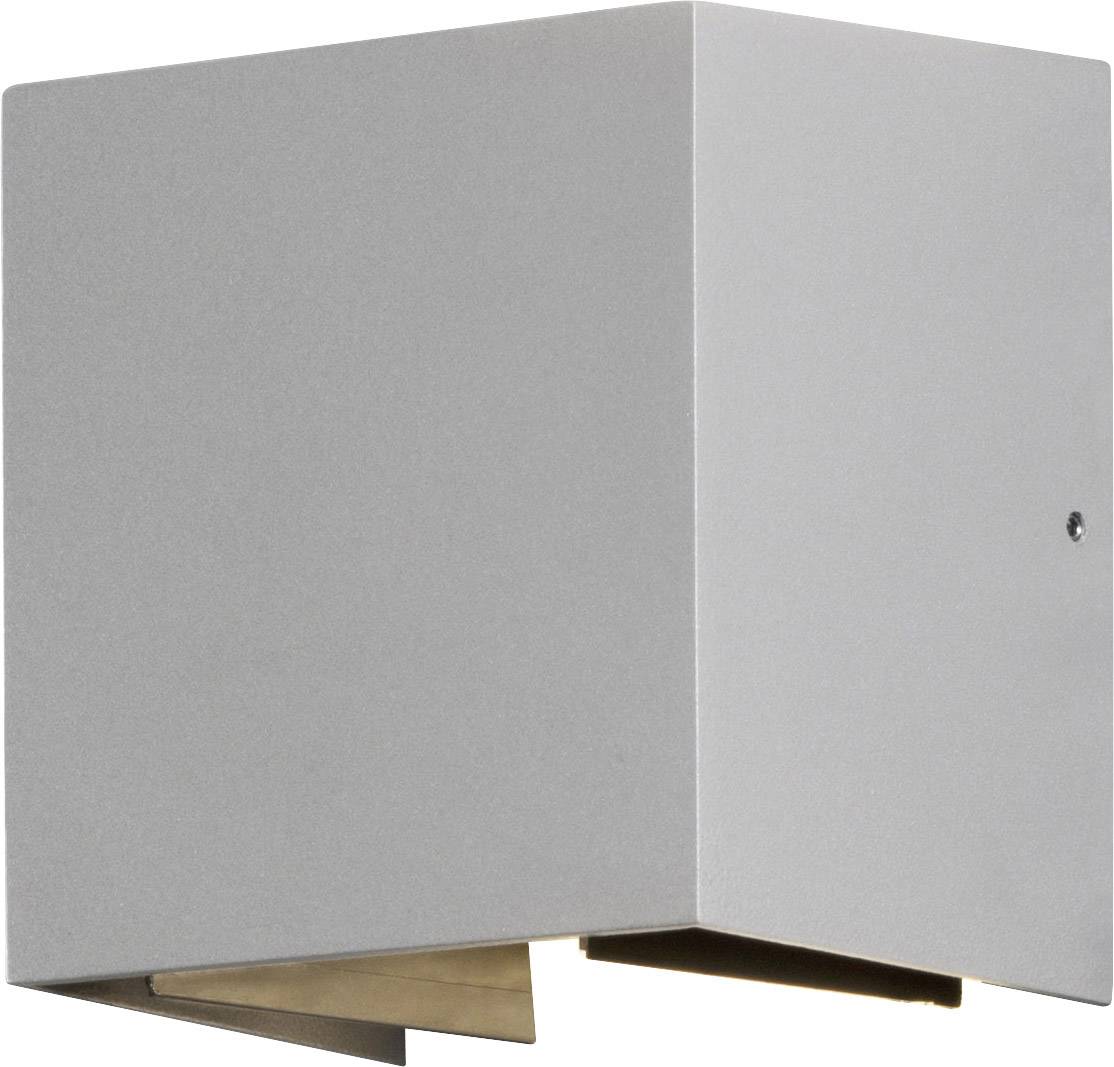 Würfelförmige, graue Wandleuchte mit Lichtauslass nach unten. Minimalistisches Design.