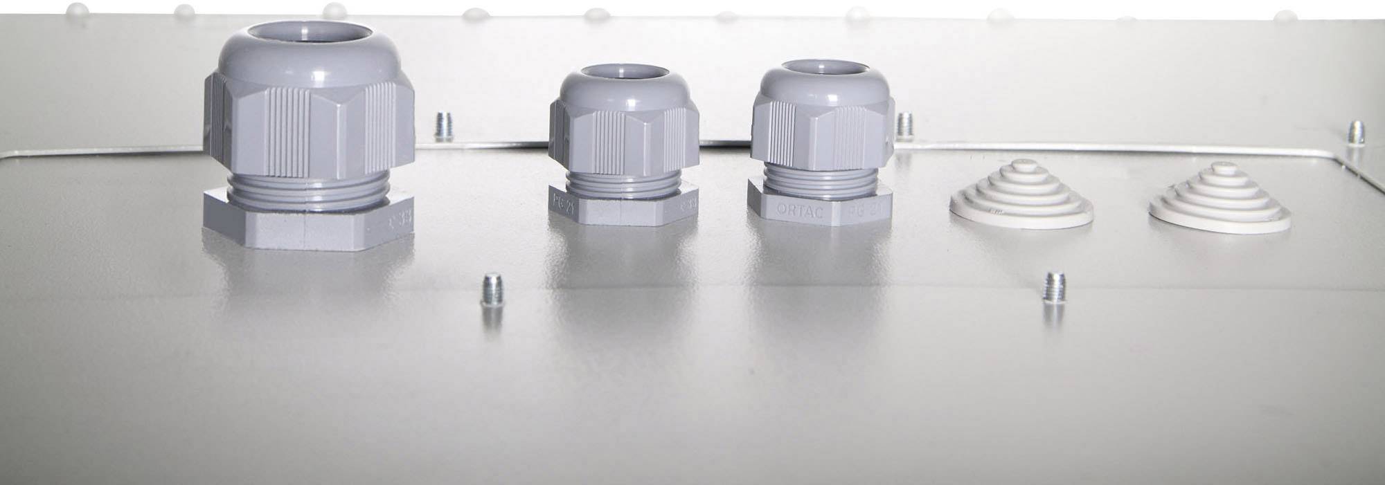 Grauer Kasten mit drei Kabelverschraubungen und zwei Gummistopfen auf der Oberseite. Technische Komponente zur Kabeldurchführung.