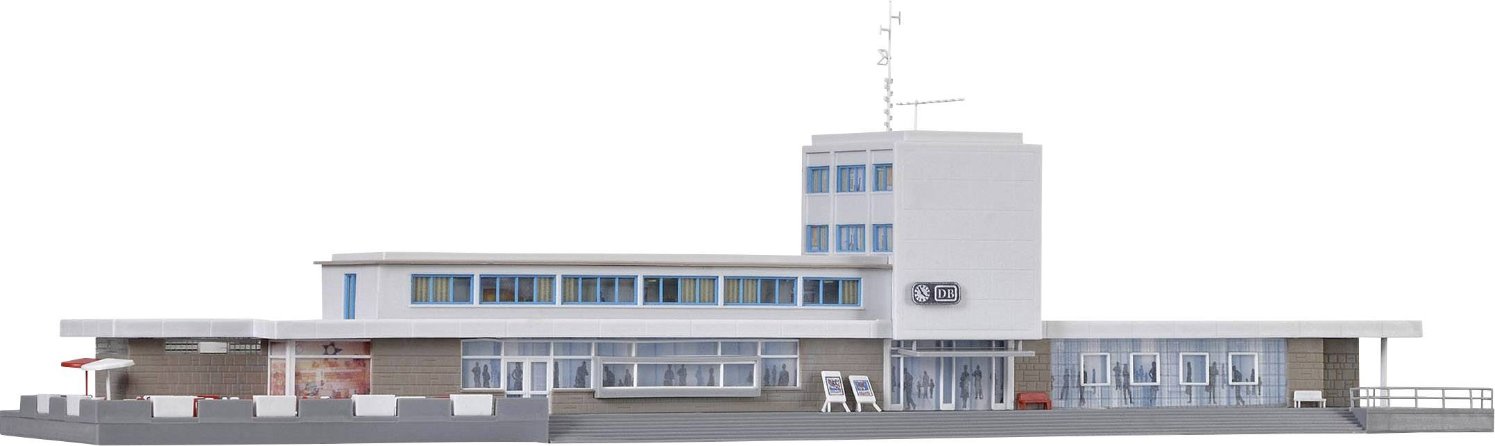 Ein modernes, einstöckiges Gebäude mit Flach- und Wachturm. Große Glasfenster dominieren die Fassade; das Dach ist mit Antennen bestückt.