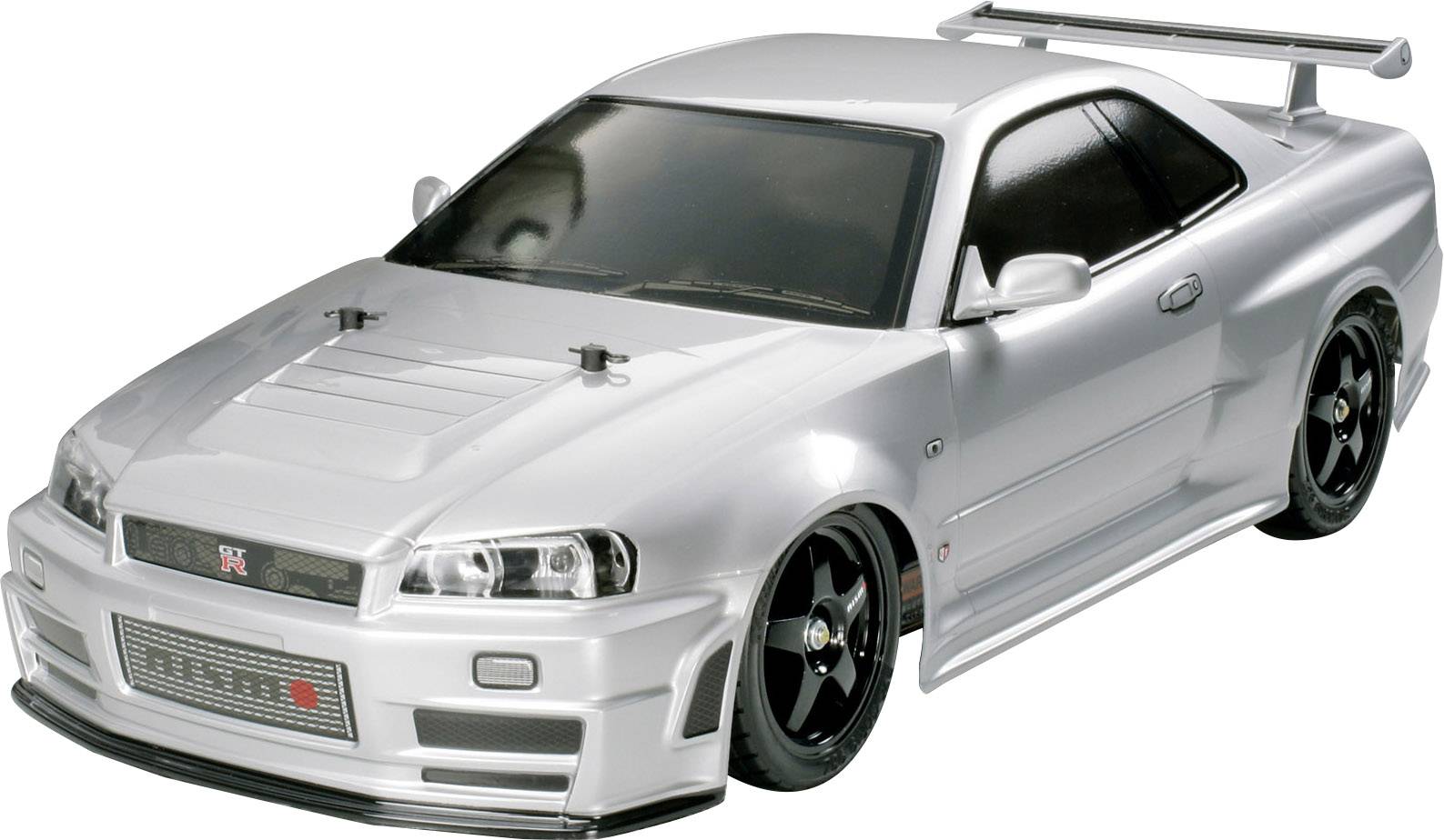 Ein silbernes Modellauto mit sportlichem Design und Heckspoiler, basierend auf einem berühmten Sportwagen.