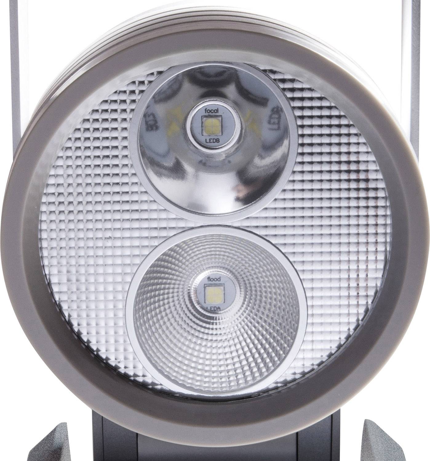 Nahaufnahme einer runden LED-Lampe mit zwei Leuchtmitteln, die in einem Gittermuster eingefasst sind.