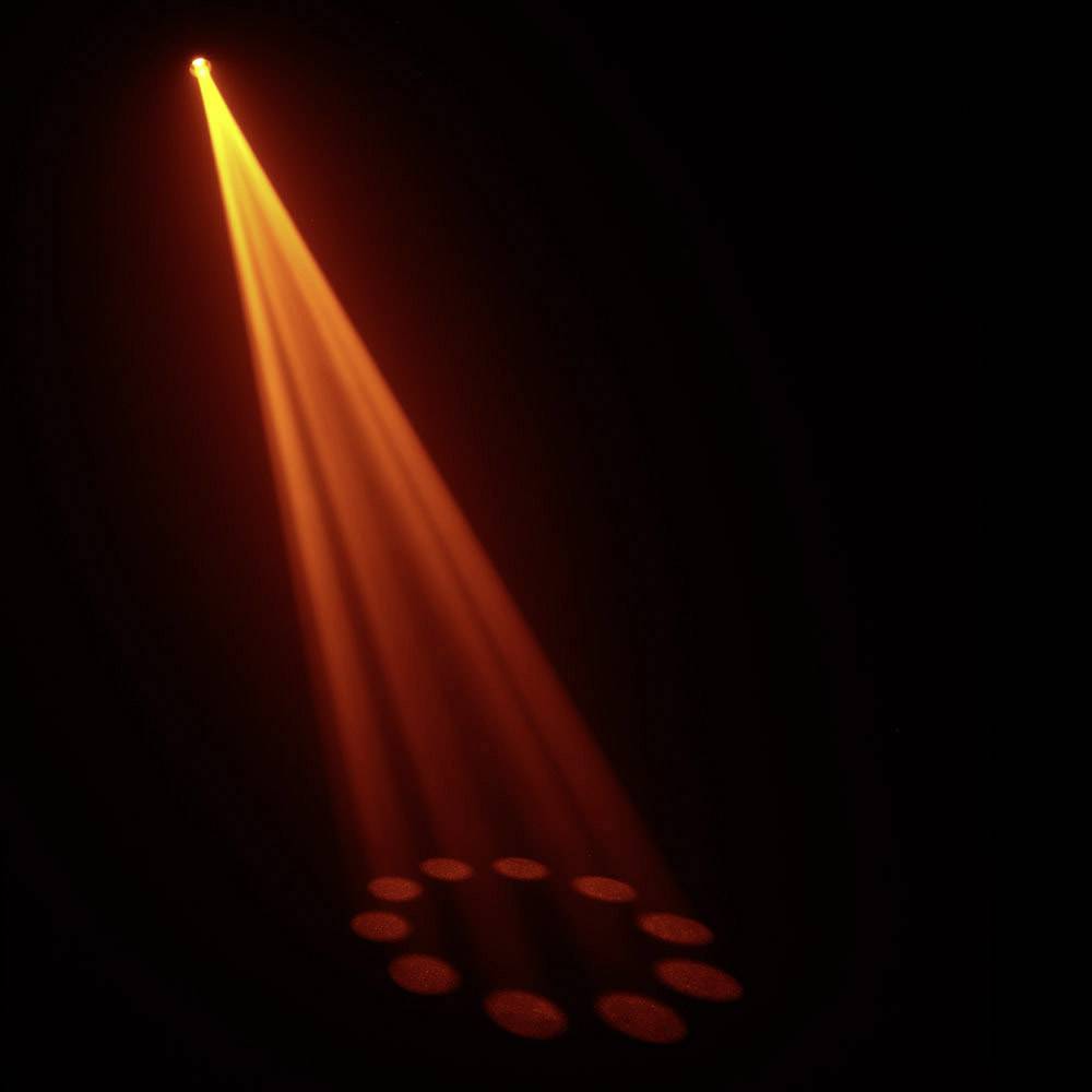 Ein einzelner, orangefarbener Lichtstrahl erleuchtet einen Kreis aus Punktlichtern auf einem dunklen Hintergrund.