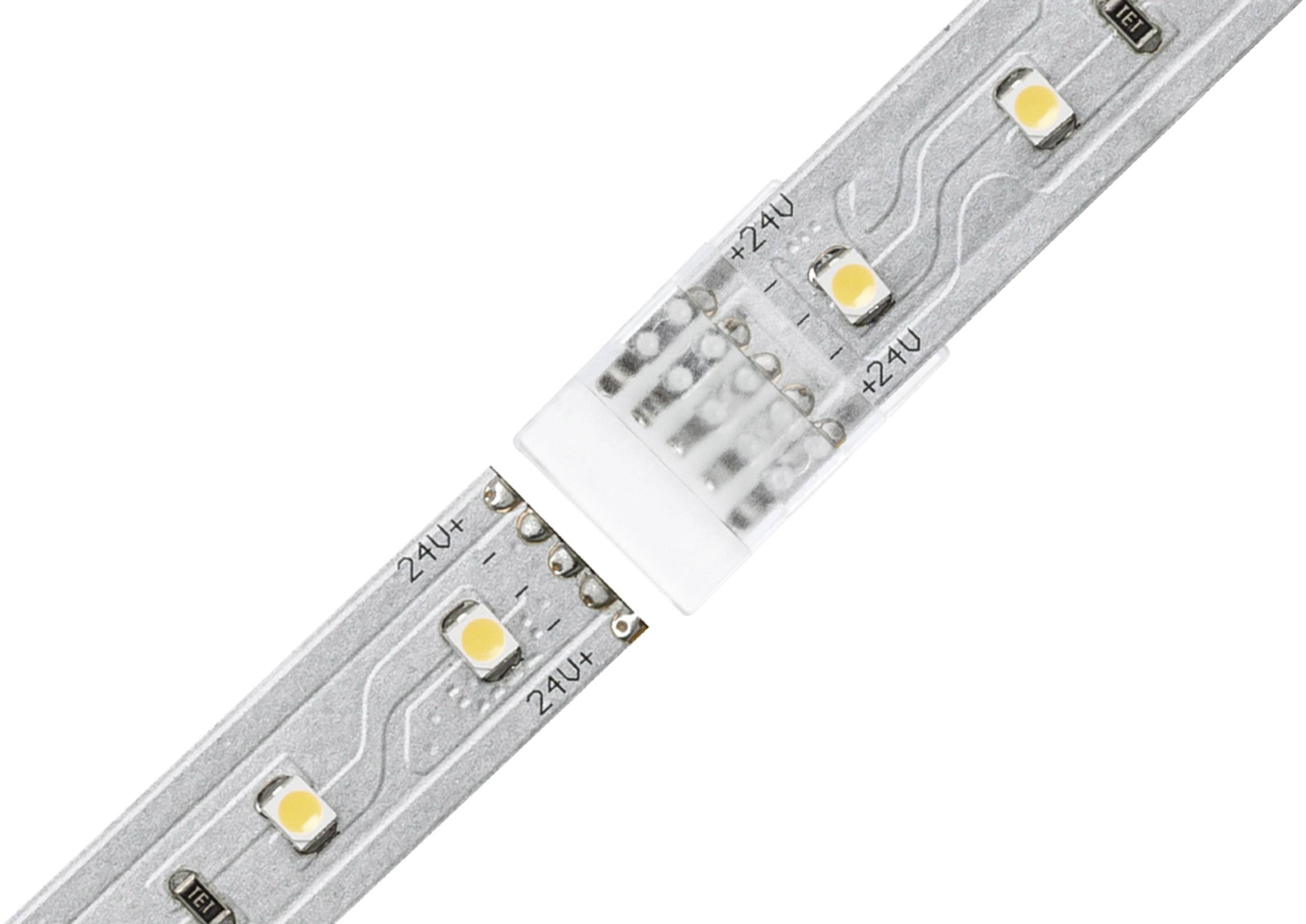 LED-Streifen mit fünf gelben Dioden auf silberner Oberfläche. In der Mitte ist ein weißer Verbinder zu sehen.
