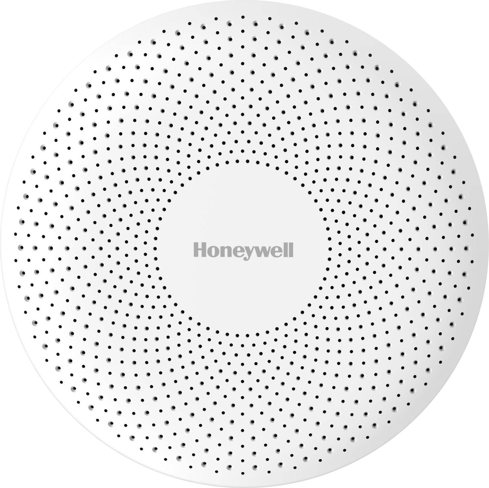 Runder, weißer Rauchmelder mit der Aufschrift 'Honeywell' in der Mitte. Oberfläche ist gleichmäßig perforiert.