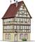 Ein dreistöckiges Fachwerkhaus mit roten Dachziegeln. Fensterläden sind grün, eine hölzerne Verzierung unterstreicht die Architektur.