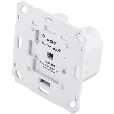 Quadratisches weißes Gerät mit zentraler Vertiefung, Beschriftung 'HmIP-BDT Dimming Actuator for brand switches'.