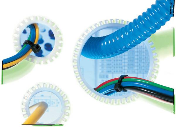 Farbbild mit elektrischen Kabeln und Schläuchen in verschiedenen Farben, die durch runde Öffnungen verlaufen, auf weißem Hintergrund.