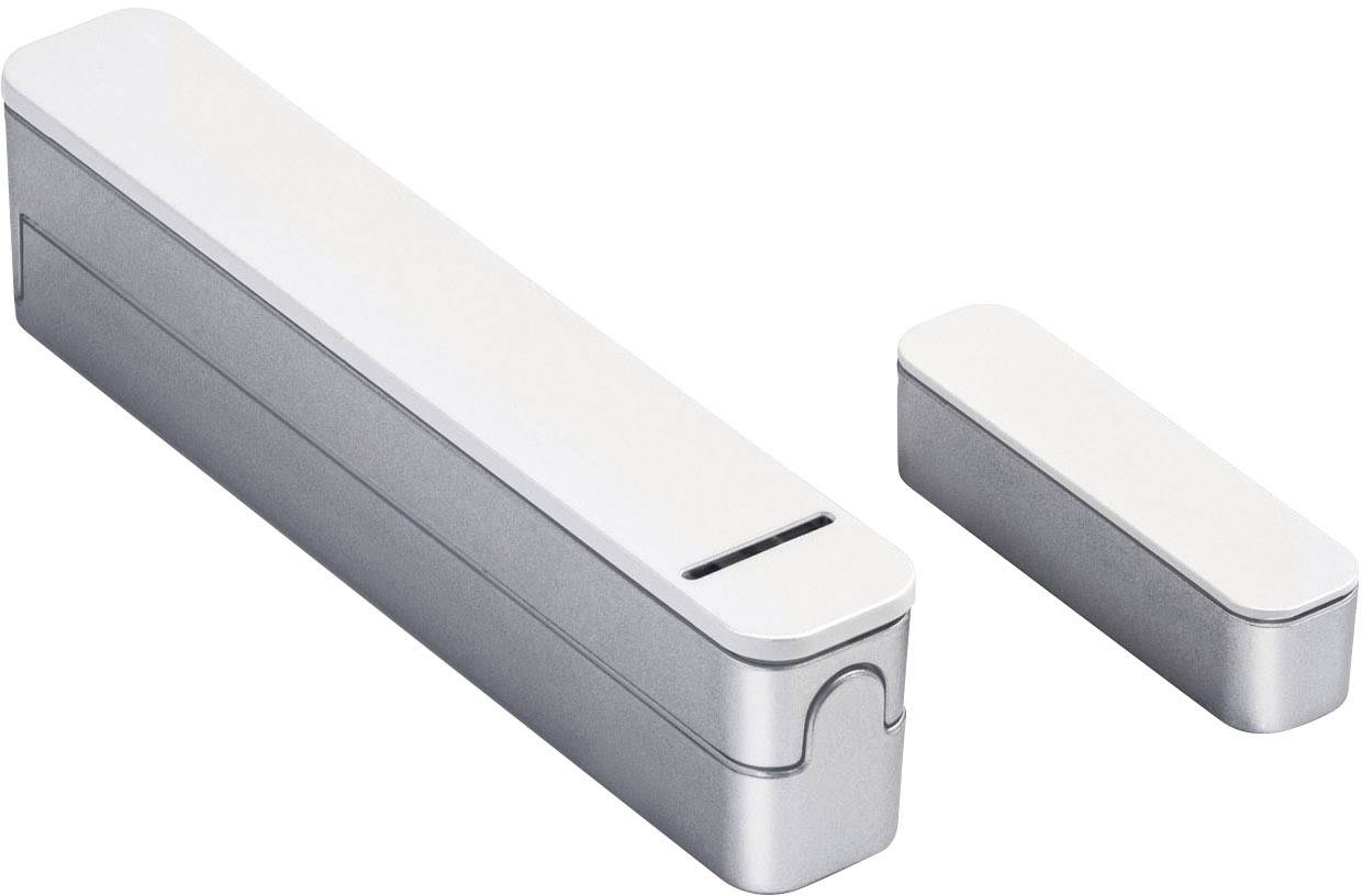 Ein silbernes rechteckiges Gerät, möglicherweise ein Tür- oder Fenstersensor, bestehend aus zwei Teilen unterschiedlichen Größen.