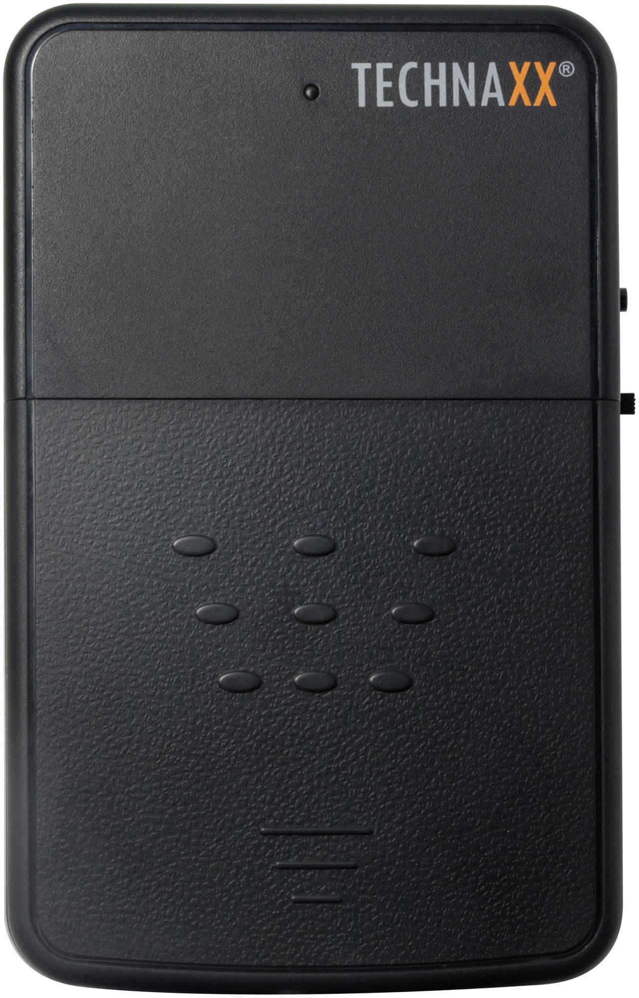 Schwarzes elektronisches Gerät mit der Aufschrift 'TECHNAXX' oben rechts. Es hat Knöpfe in der Mitte und oben eine kleine LED.