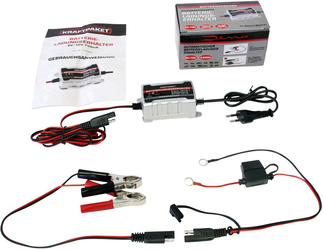 Batterieladegerät mit Kabeln und Klemmen, inklusive Bedienungsanleitung und Verpackung. Geeignet für Automobilbatterien.