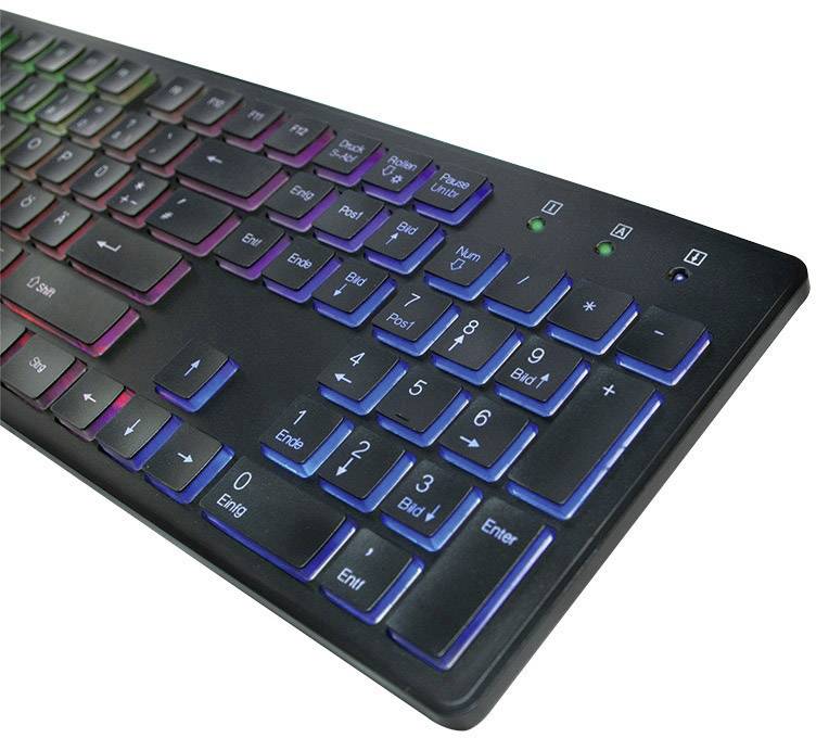 Schwarze Computertastatur mit farbiger LED-Hintergrundbeleuchtung. Die Tasten leuchten in Rot, Blau und Grün, was das Tippen im Dunkeln erleichtert.