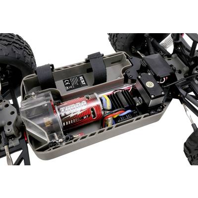 Ein ferngesteuertes Auto mit offenem Gehäuse zeigt den Motor mit der Aufschrift 'Turbo', Elektronikkomponenten und Kabel.