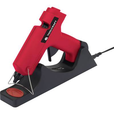 Ein roter Heißkleber sitzt schräg auf einer schwarzen Basis. Ein Kabel ist mit der Basis verbunden.