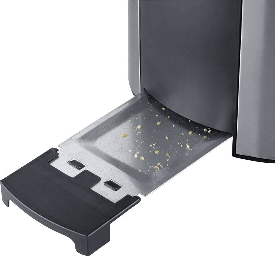 Ein Toaster mit herausgezogener Krümelschublade, die einige Krümel zeigt.