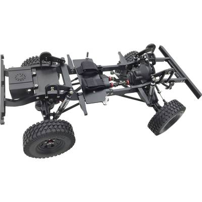 Ein Modellauto-Chassis mit grobstolligen Rädern, Federungen und Metallrahmen, bereit für den Zusammenbau eines Geländewagens.