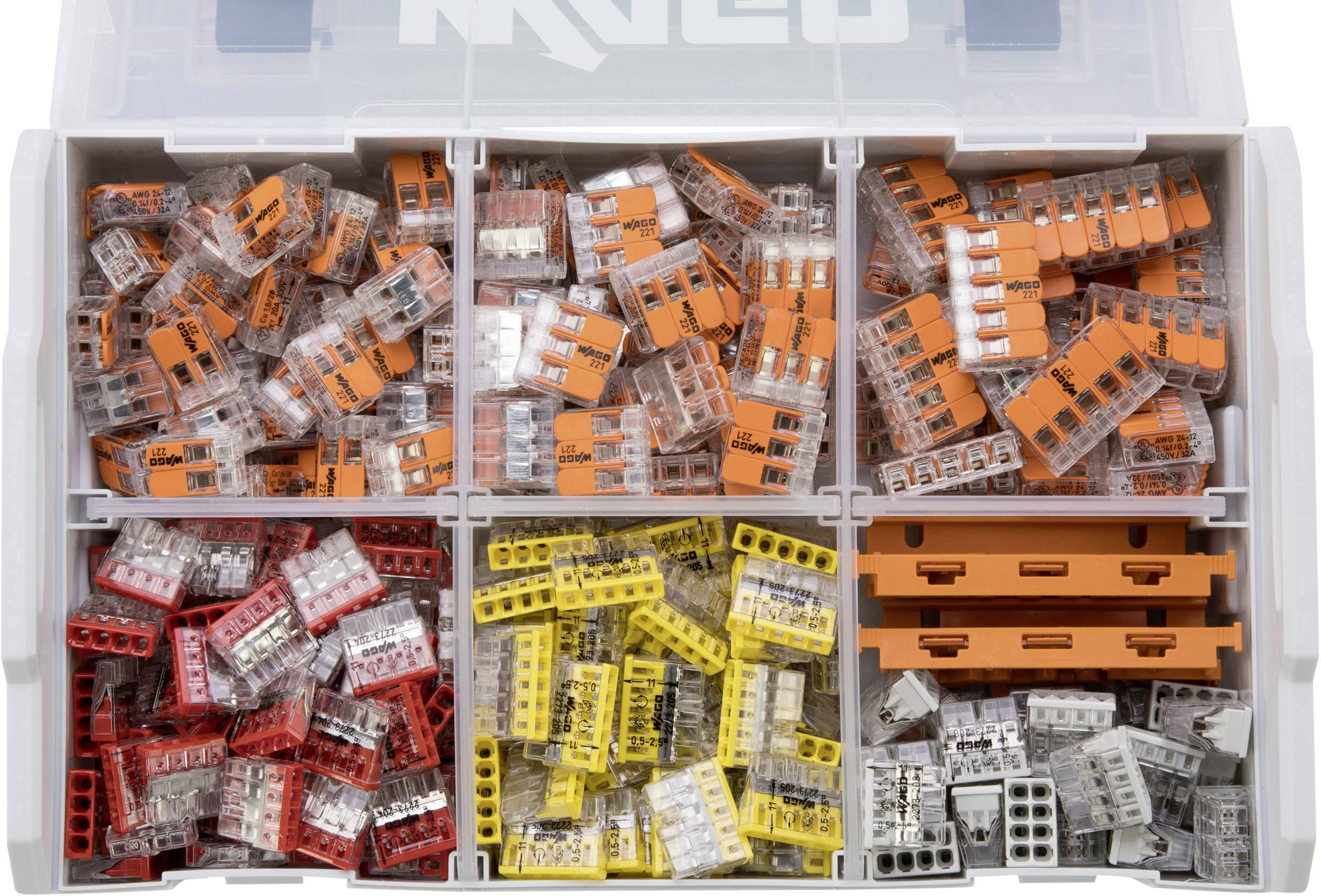 Eine Sortierbox mit verschiedenen farbigen Steckklemmen: orange, rot, gelb und weiß. Jede Farbe befindet sich in einem separaten Fach.