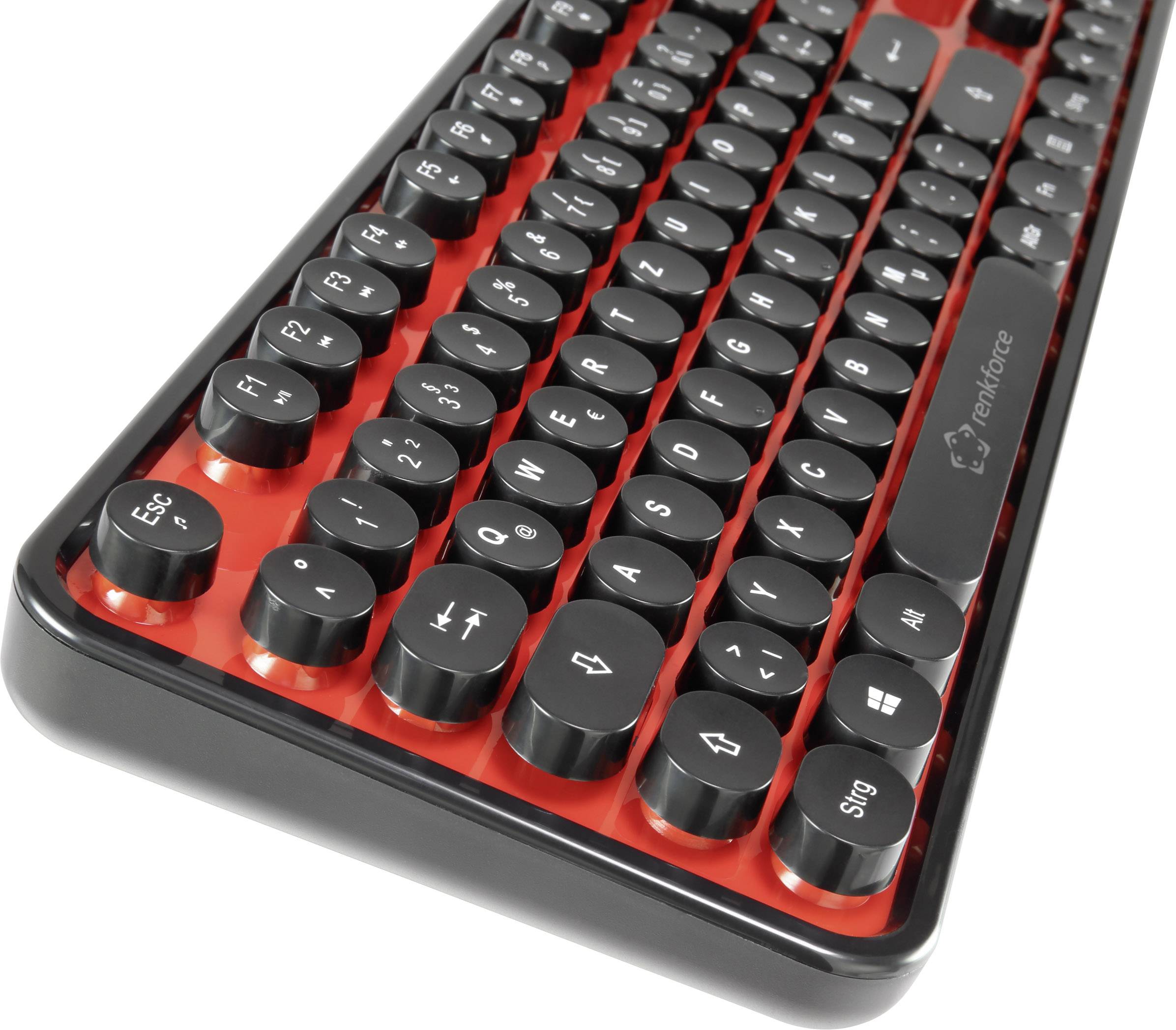 Eine schwarze Tastatur mit runden Tasten auf rotem Untergrund, im Retro-Stil gestaltet.