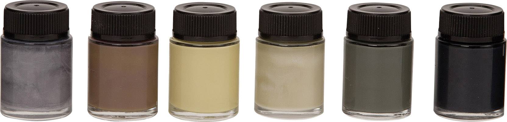 Sechs kleine Gläser mit Schraubdeckeln, jeweils gefüllt mit unterschiedlichen Farbpigmenten: grau, braun, beige, gelb, grün und schwarz.