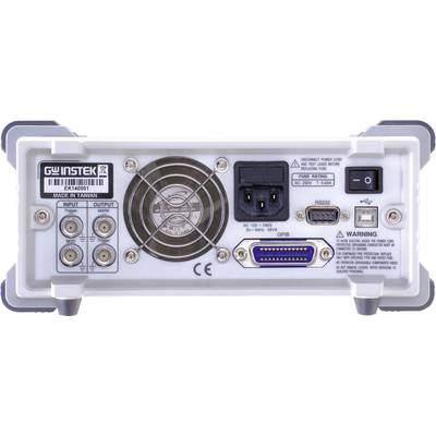 Rückseite eines elektronischen Geräts mit verschiedenen Anschlüssen und einem Lüfter in der Mitte. Herstelleretikett und Warnhinweise sind sichtbar.