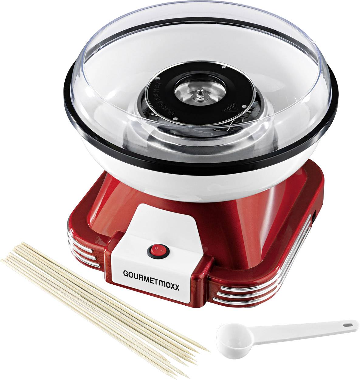 Eine rote Zuckerwattemaschine mit transparentem Deckel, daneben Holzspieße und ein weißer Messlöffel.