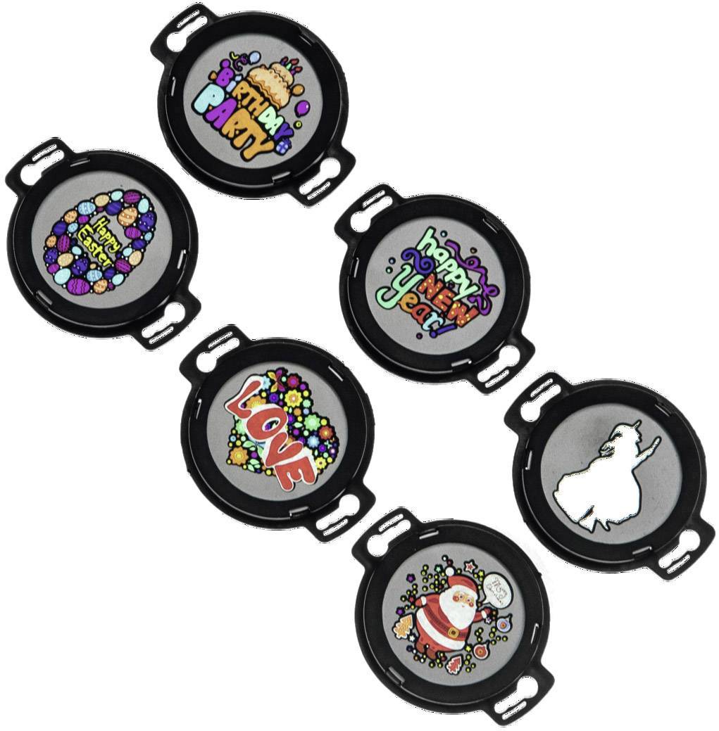 Sechs runde schwarz-weiße Aufsätze mit bunten Motiven und Texten wie 'Love' und 'Happy New Year'. Dekorative Designs für festliche Anlässe.