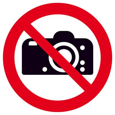 'Fotografieren verboten' Zeichen zeigt eine durchgestrichene Kamera in einem roten Kreis, was darauf hinweist, dass Fotos nicht erlaubt sind.