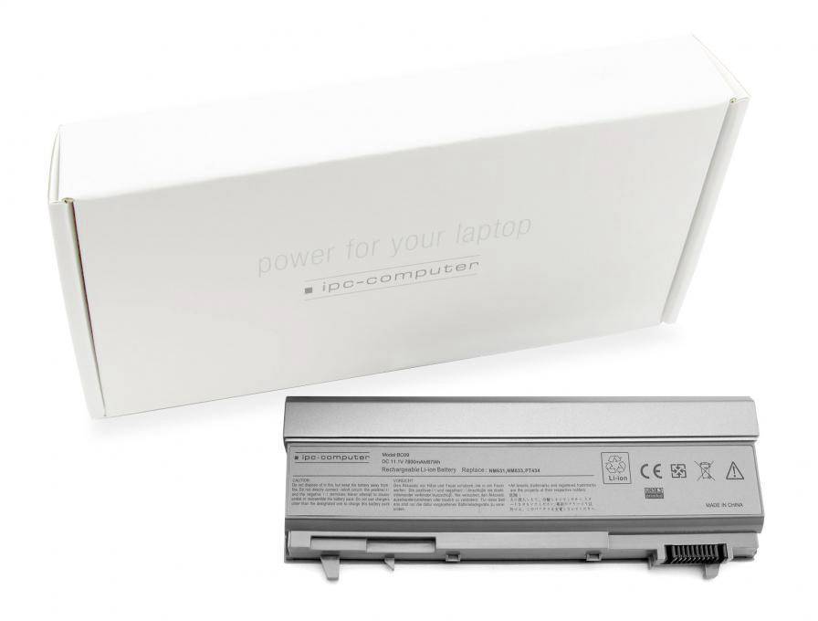 Ein grauer Laptop-Akku liegt vor einer weißen Verpackung mit der Aufschrift 'power for your laptop'.