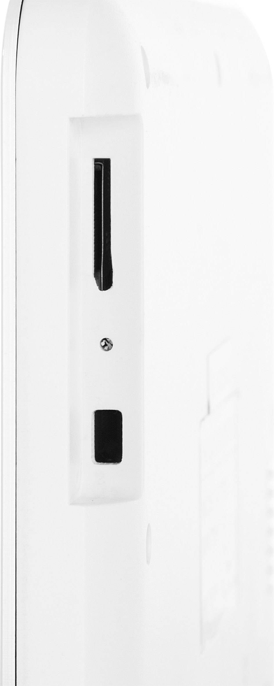 Ein weißes elektronisches Gerät mit einem Steckplatz für eine Speicherkarte und einem schwarzen Schalter, Ansicht von der Seite.