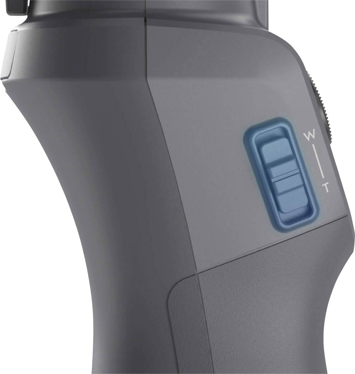 Seitlicher Blick auf ein elektronisches Gerät mit einem blauen Schalter. Markierungen 'W' und 'T' sind neben dem Schalter sichtbar.