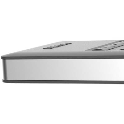 Ein silbernes, flaches elektronisches Gerät mit abgerundeten Ecken und schwarzen Details, möglicherweise ein Laptop oder Tablet.