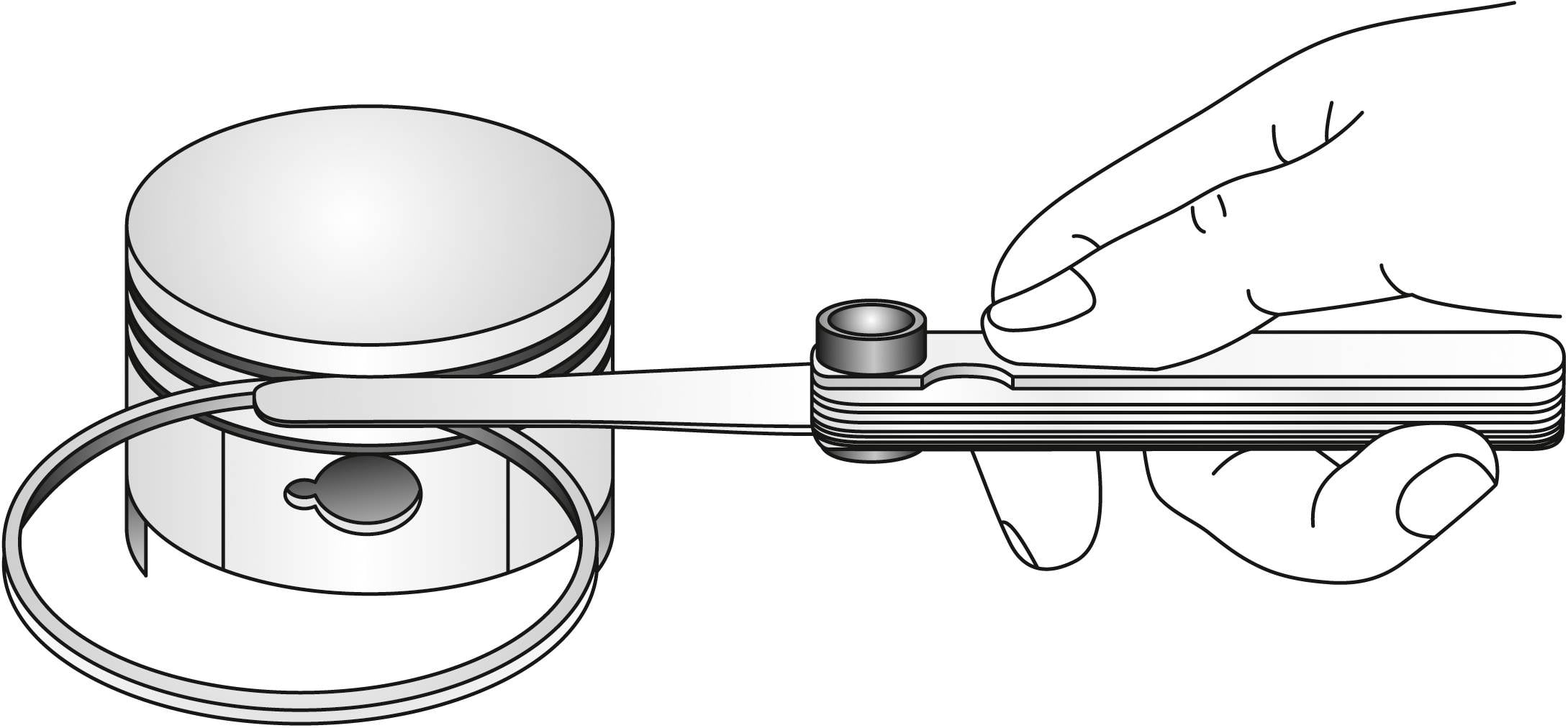 'Hand hält Kolbenringzange, setzt Kolbenring auf Kolben. Werkzeug verhindert Bruch beim Anbringen.'