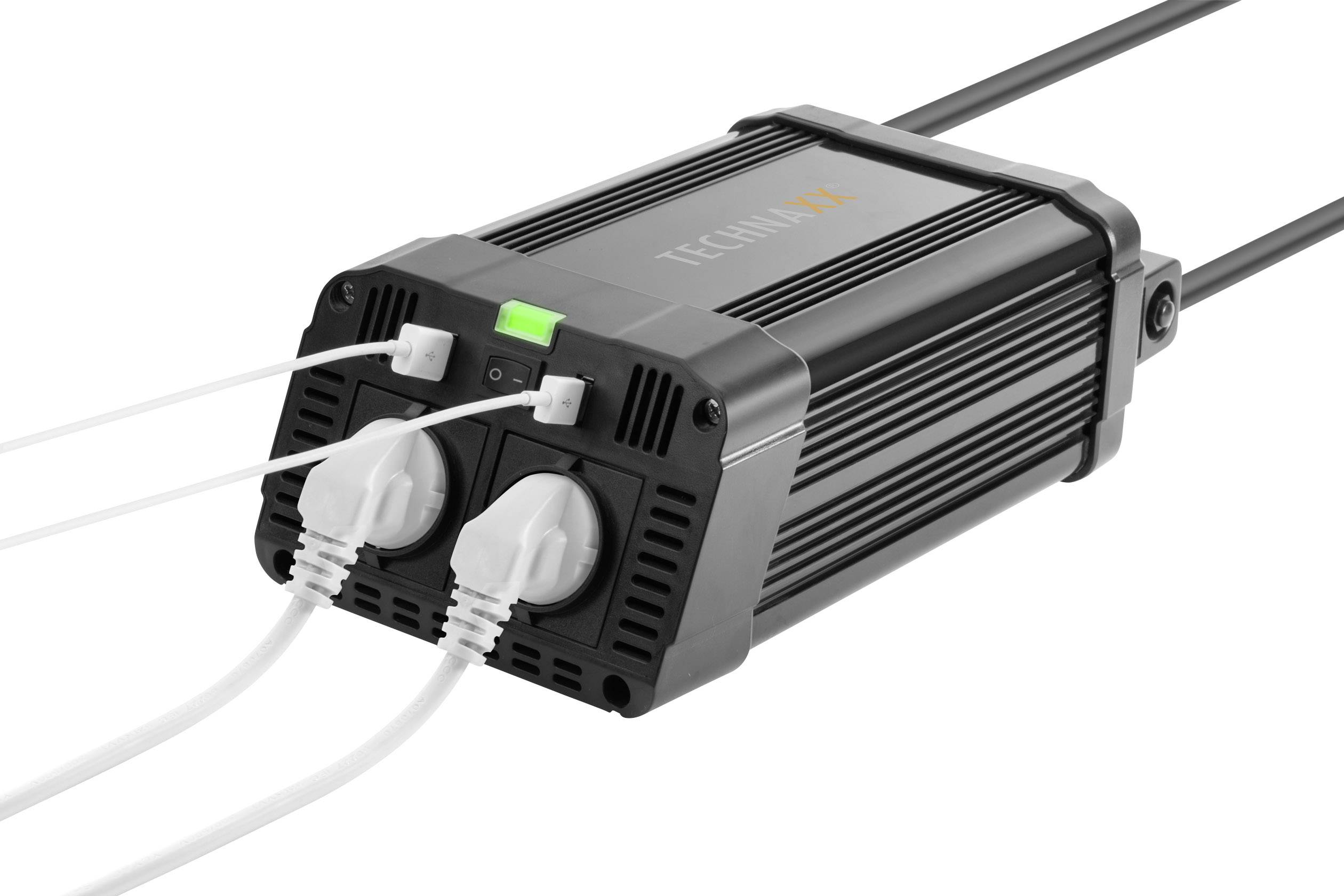 Schwarzes elektrisches Gerät mit zwei weißen Kabeln, LED-Anzeige leuchtet grün, Markenname 'TECHNIMAX' auf der Oberseite sichtbar.