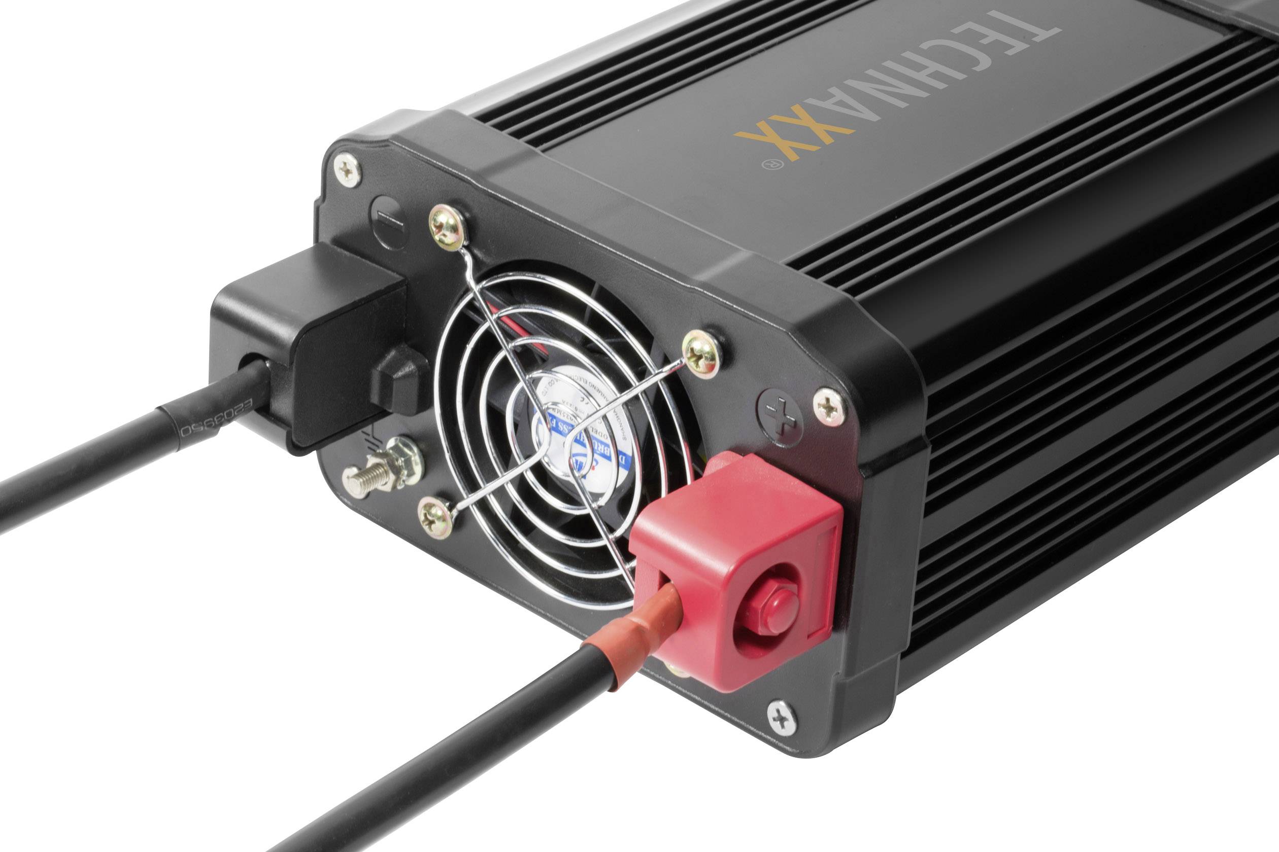 Ein schwarzes elektronisches Gerät mit Lüfter und zwei Kabeln, einem schwarzen und einem roten, das für Stromanschlüsse verwendet wird.