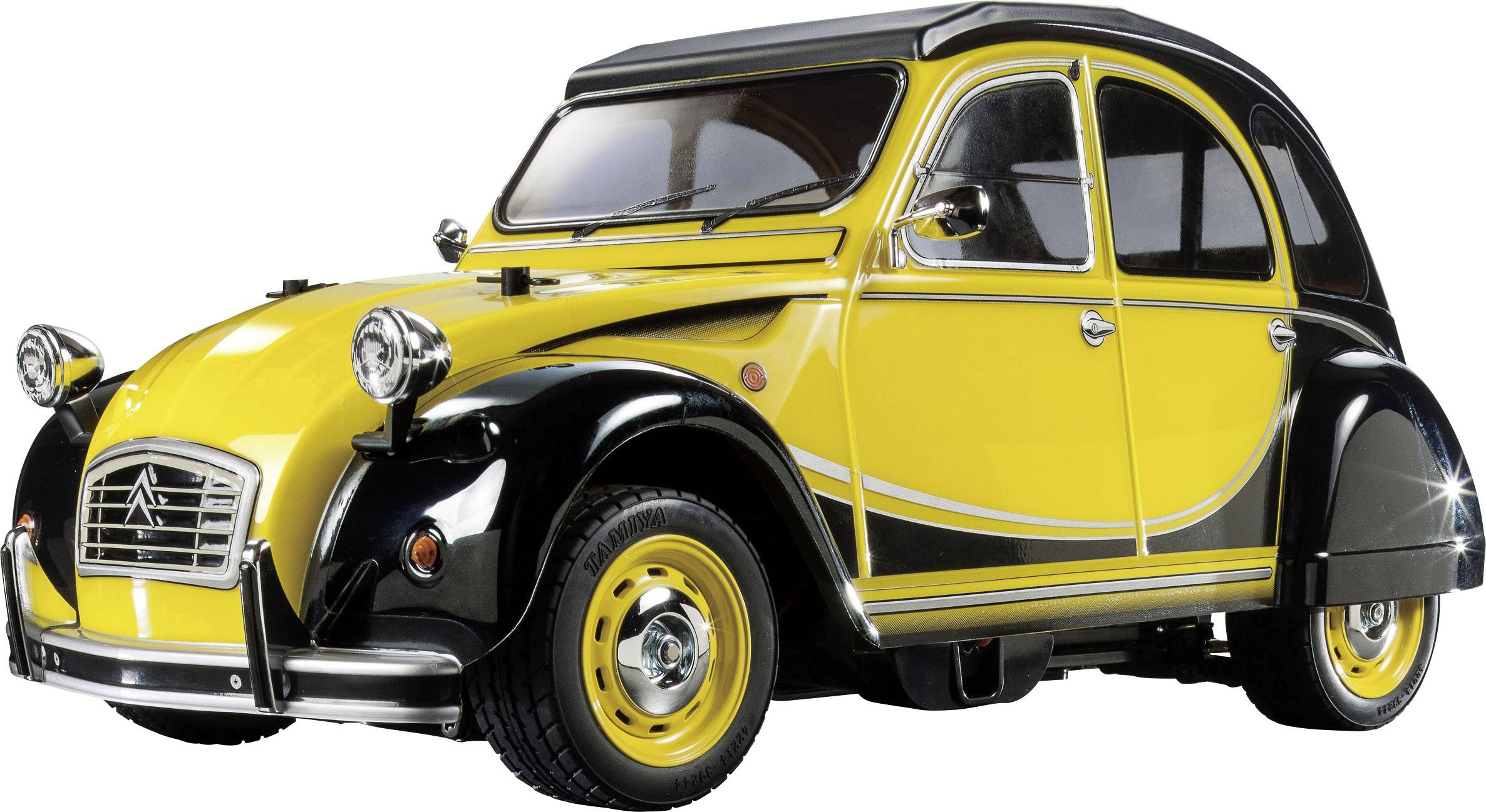 Gelbes und schwarzes Oldtimer-Auto mit runden Scheinwerfern und charakteristischer Karosserieform, seitliche Ansicht. 