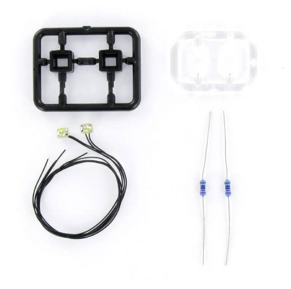 'Einzelteile eines Elektronik-Kits: schwarzer Kunststoffrahmen, transparente Abdeckung, zwei LEDs mit Kabeln und zwei Widerstände.'