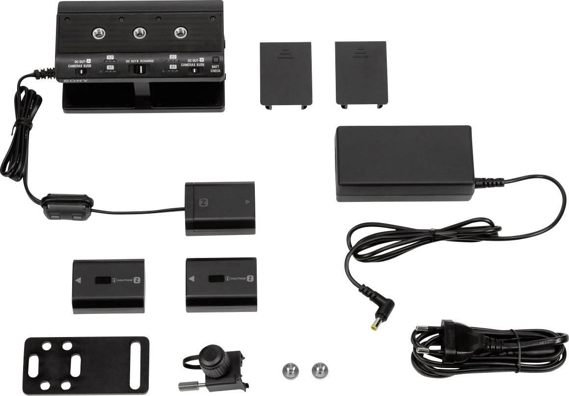 Ladegerät mit Akkus und Kabeln. Enthält zwei Batterien, zwei Abdeckungen und ein Netzteil. Zubehör für Kameraausrüstung.