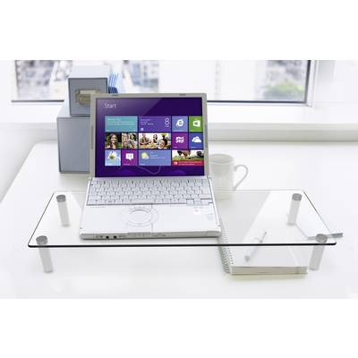 Ein Laptop mit Windows 8 ist auf einem Glastisch platziert. Im Hintergrund ist Fensterblick auf eine Stadt. Daneben stehen eine Tasse und ein Notizbuch.