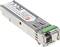 Ein SFP-Transceiver-Modul für Netzwerkverbindungen. Silbernes Gehäuse mit grünen Markierungen und Etikett mit technischen Spezifikationen.