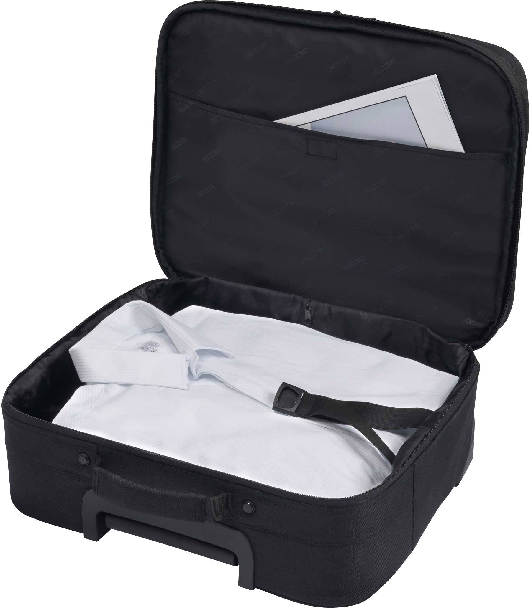 Ein geöffneter schwarzer Koffer enthält ein weißes Hemd und einen geschlossenen Umschlag im Deckelfach.