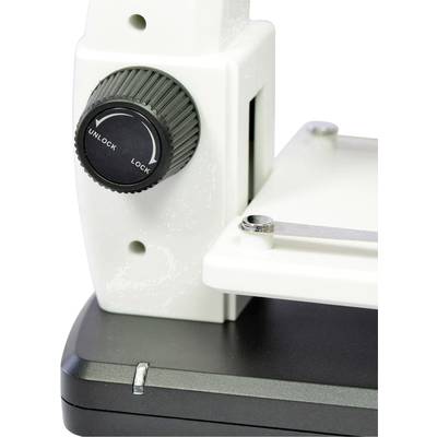 Mikroskopeinstellung mit Drehknopf, der zwischen 'Unlock' und 'Lock' zeigt; weiße und schwarze Komponenten sichtbar.