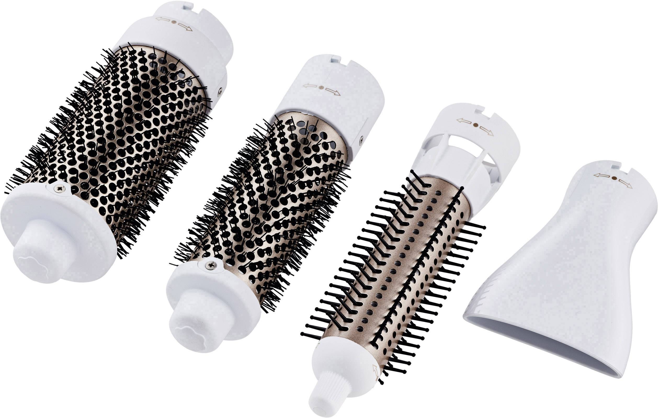 Drei austauschbare Haarbürstenaufsätze und ein Diffusor für einen Föhn. Jede Bürste hat unterschiedliche Borsten zur Haarpflege.