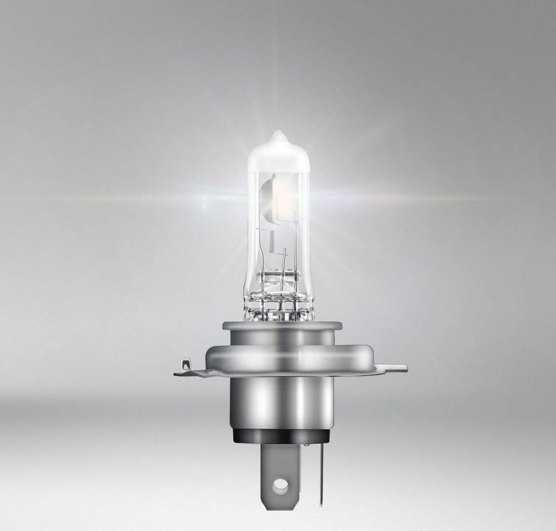 Eine leuchtende Halogenlampe vor grauem Hintergrund. Sie strahlt helles Licht aus und zeigt Details der Glühwendel.