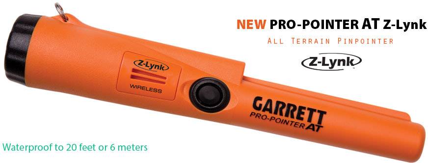 Ein orangefarbener Garrett Pro-Pointer AT Z-Lynk Metalldetektor, wasserdicht bis 6 Meter. Text: 'New Pro-Pointer AT Z-Lynk', 'Wireless'.