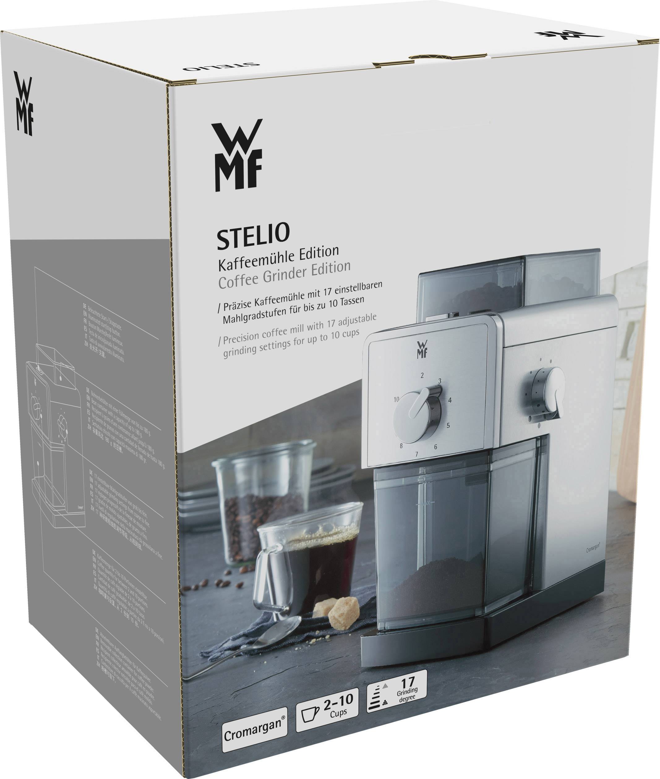 'WMF Stelio Kaffee- und Espressomühle' Verpackung. Bild zeigt das Gerät, Gläser mit Kaffeebohnen und Kaffeepulver. Mahlgrad einstellbar.